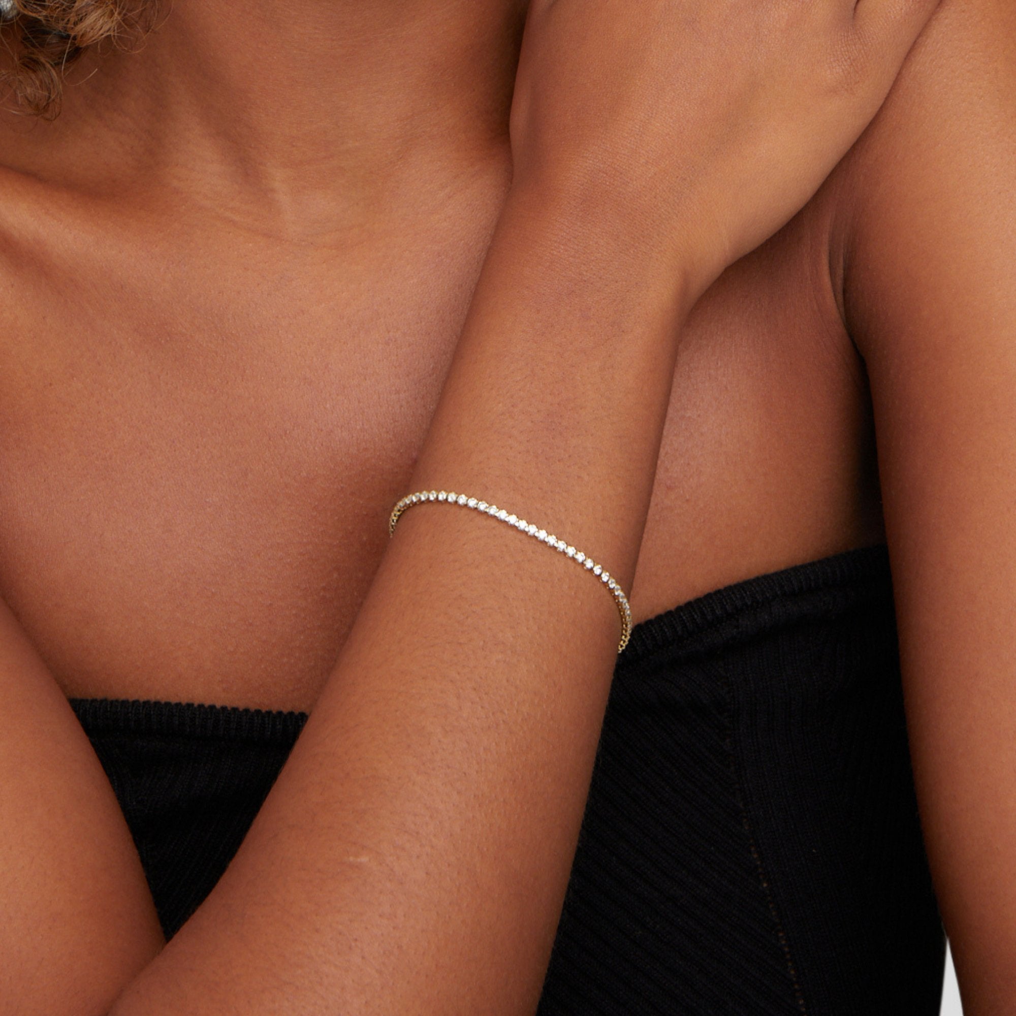 Kordelie guld tennisarmband