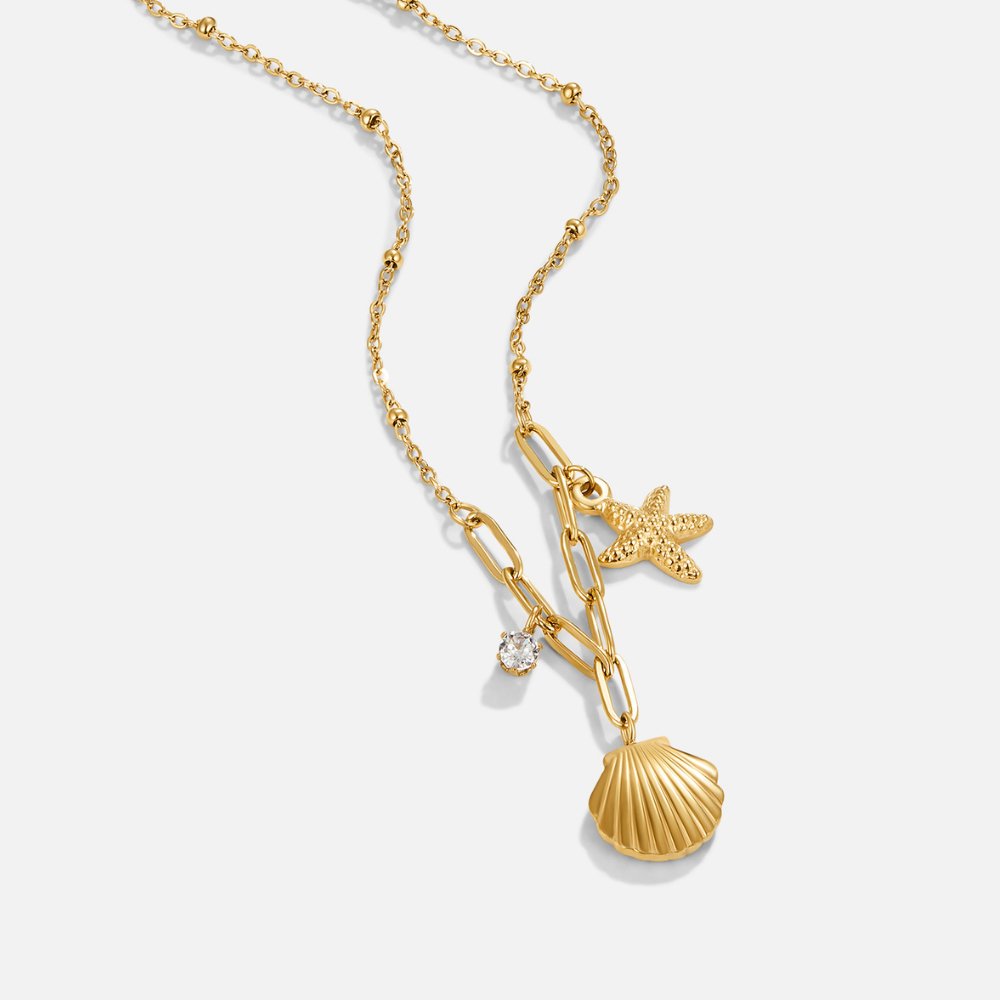 Greta – Halsband med hängande stjärna i guld.