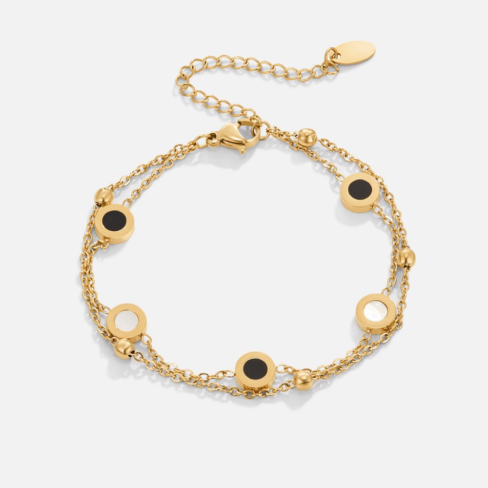 Armband av onyx och vit sten