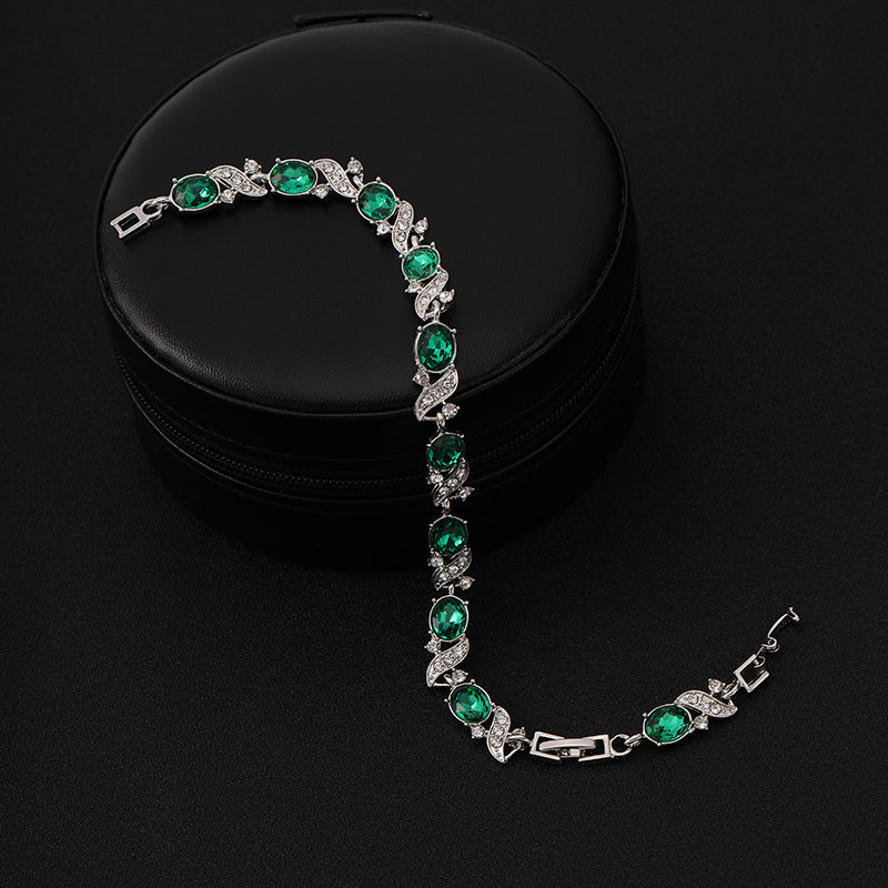 Silverarmband med smaragdgrön stenar