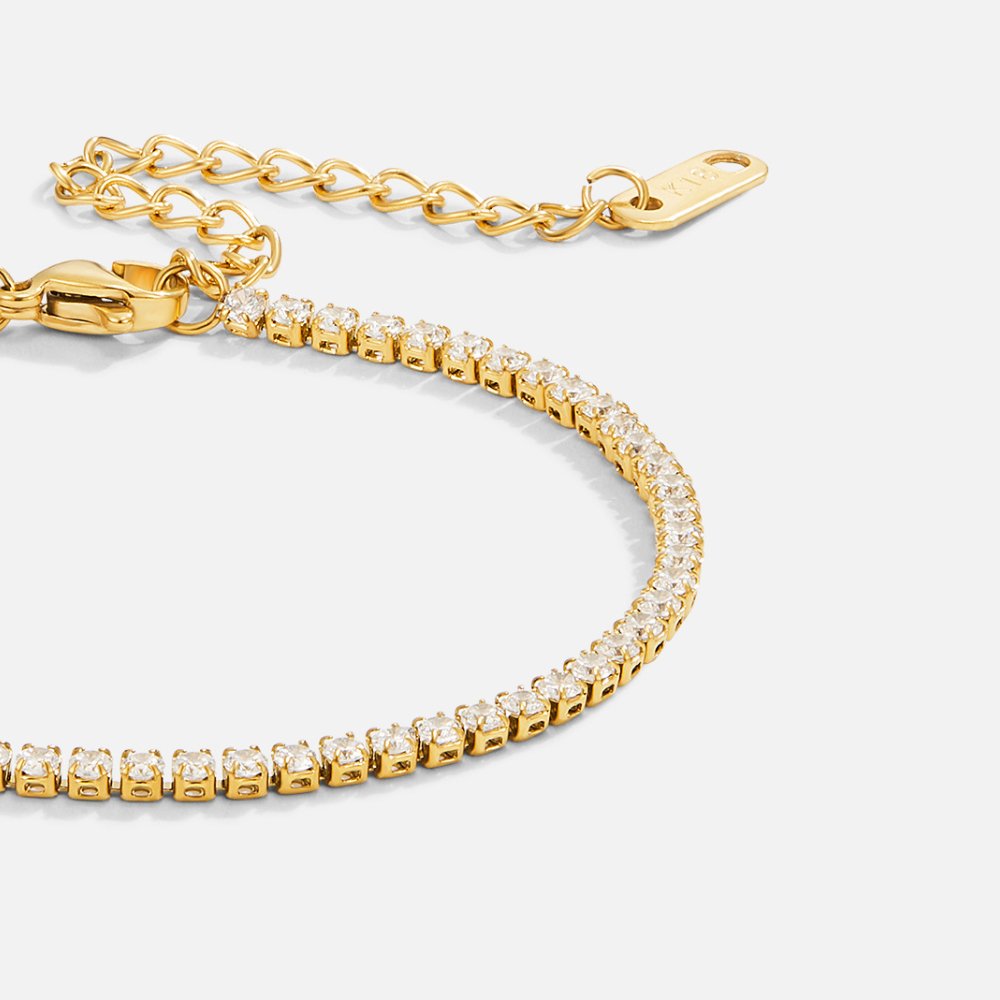 Kordelie guld tennisarmband