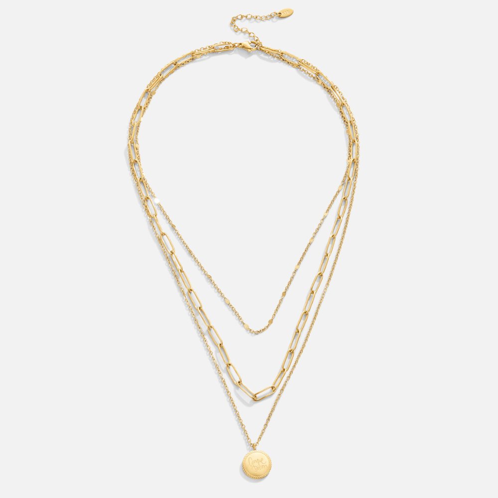 Karolina – Flera nivåer halsband med rund hängande smycke.