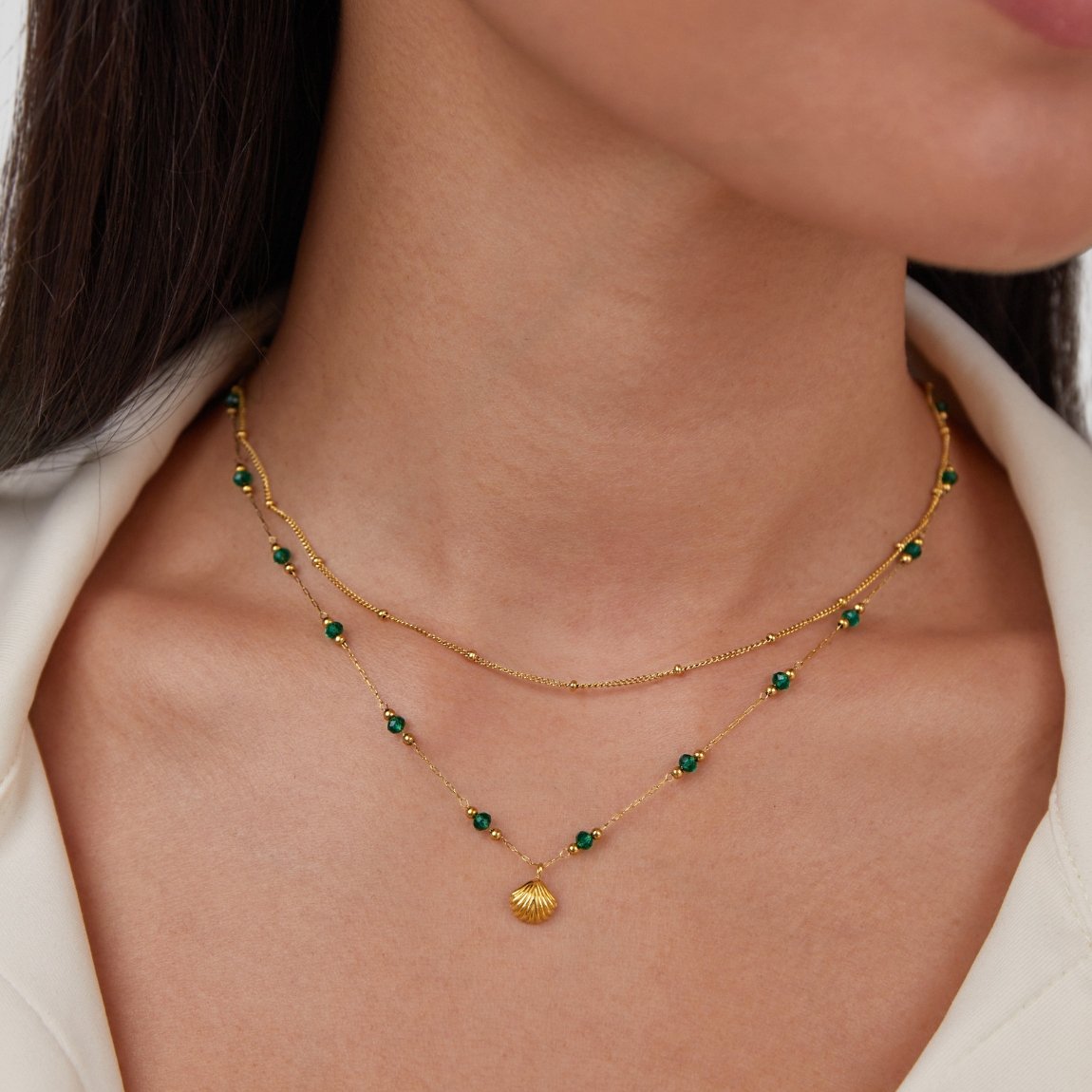 Jitka – Guld kedja med ringar i en fin design.
