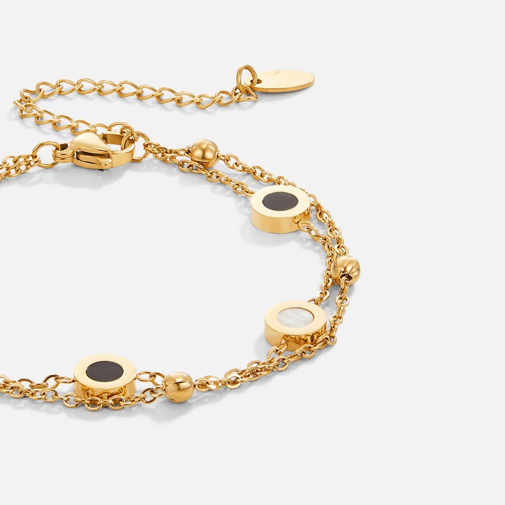 Armband av onyx och vit sten